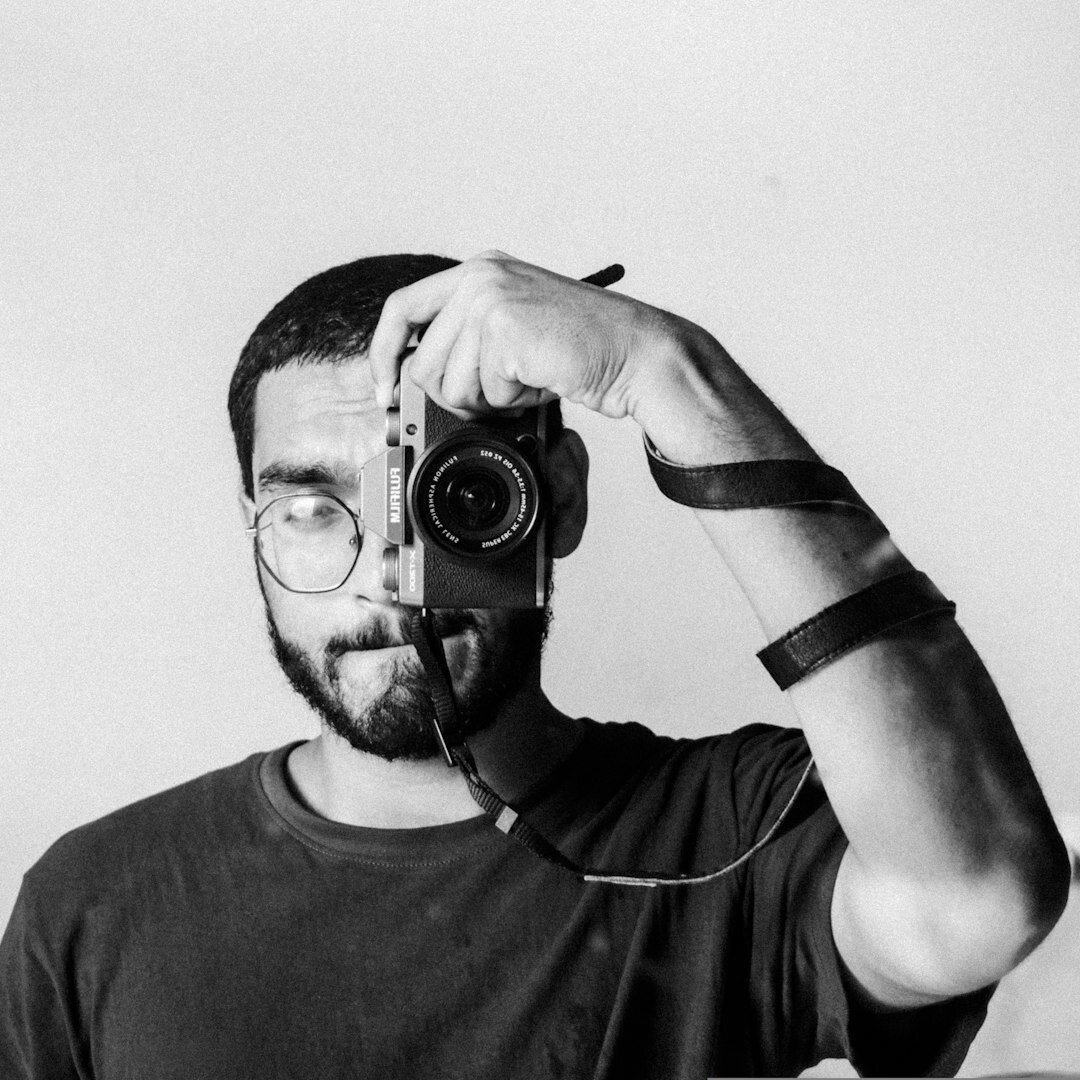 Male video production instructor with glasses