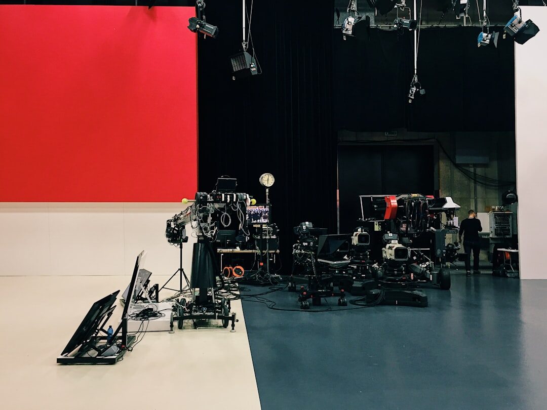TV presenter on set in front of studio cameras