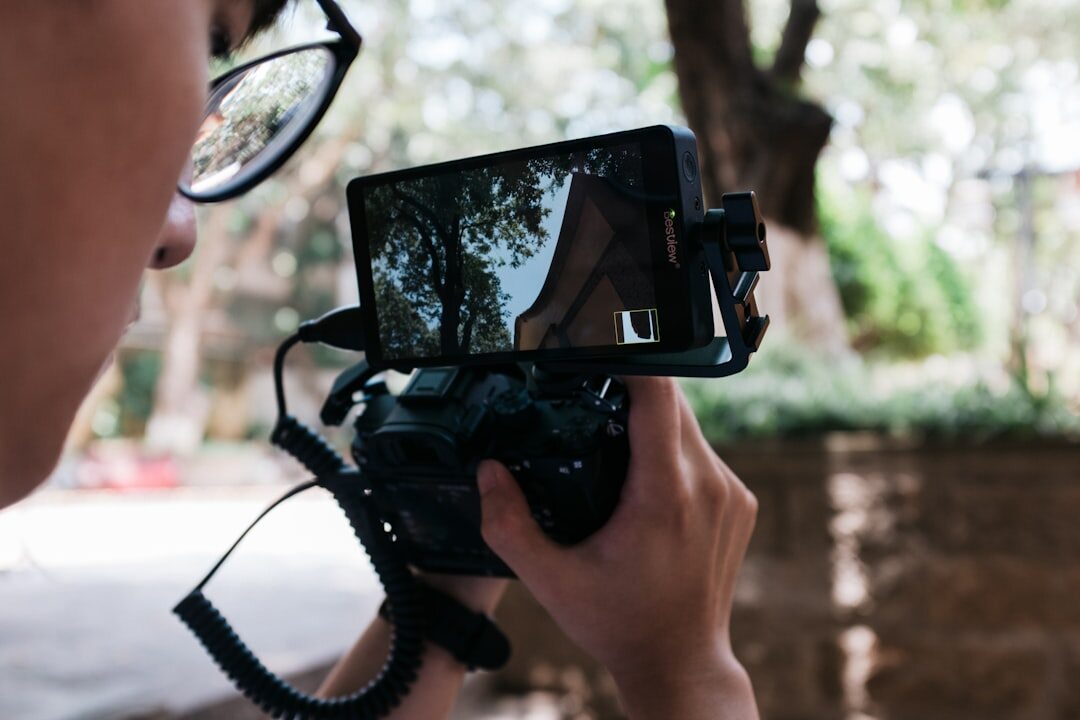 Journalist filming video content with smartphone